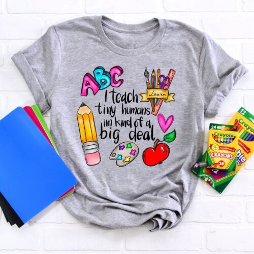 Inspirational I Teach Tiny Humans Back To School First Grade Appreciation Shirt image 0