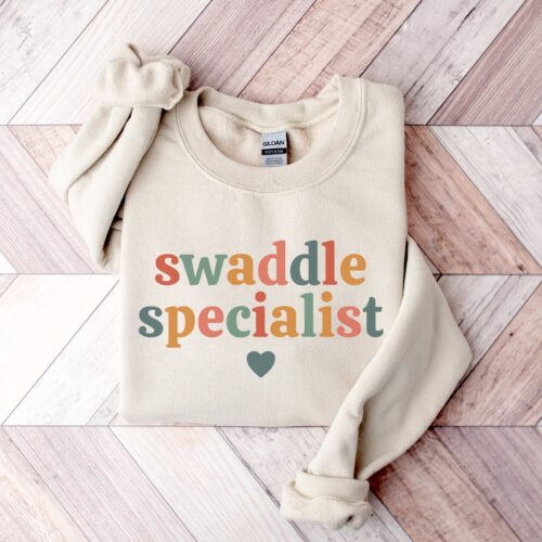 Swaddle Specialist Labor and Delivery NICU Nurse Mother Baby Team Sweatshirt image 0