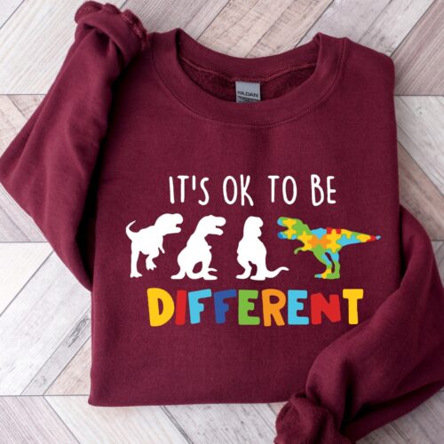 It's Ok To Be Different Autism Awareness Support Dinosaur Month Teacher Sweatshirt image 0