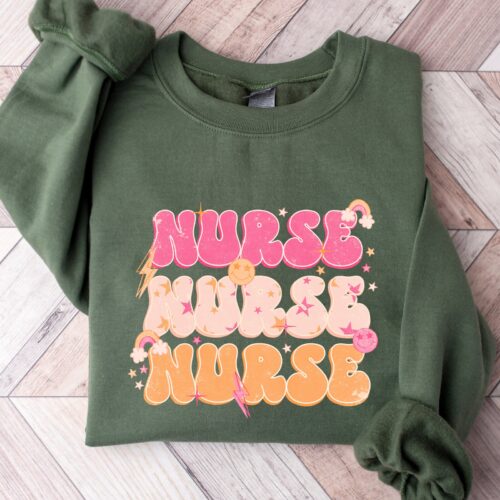 Nurse For Work Cute RN Rainbow Smile School Sweatshirt image 0