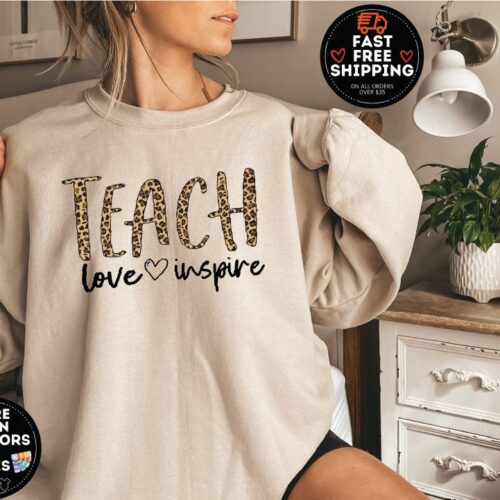 Teach Love Inspire Leopard First Grade Elementary Back To School Sweatshirt image 0