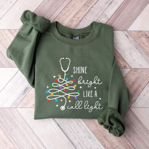 Funny Nurse Christmas Shine Bright Like A Call Light RN Sweatshirt image 0